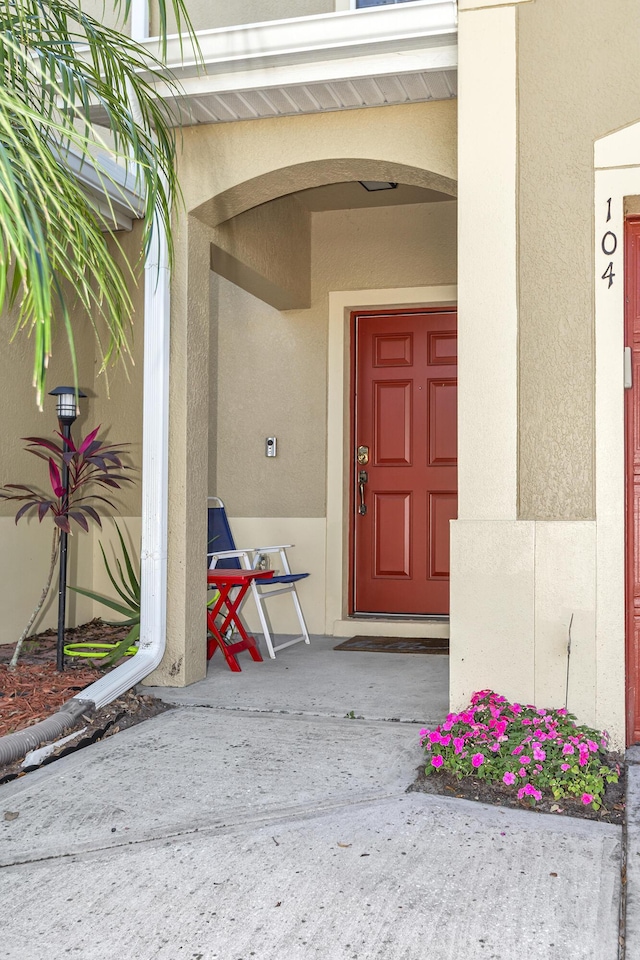 2650 Revolution St Unit 104, Melbourne, FL 32935 - property entrance featuring stucco siding