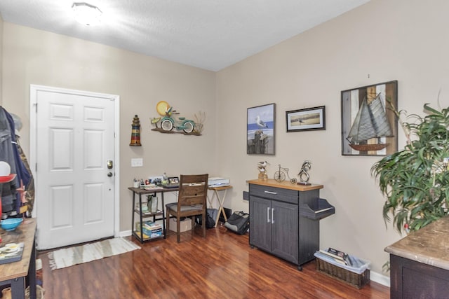 2650 Revolution St Unit 104, Melbourne, FL 32935 - office area featuring dark wood-style floors and baseboards