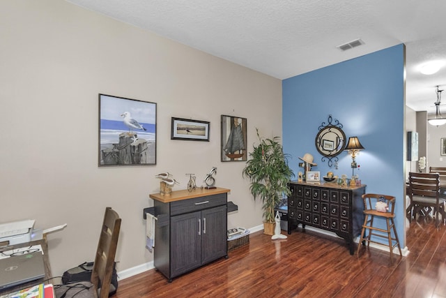 2650 Revolution St Unit 104, Melbourne, FL 32935 - office with wood finished floors, baseboards, and a textured ceiling