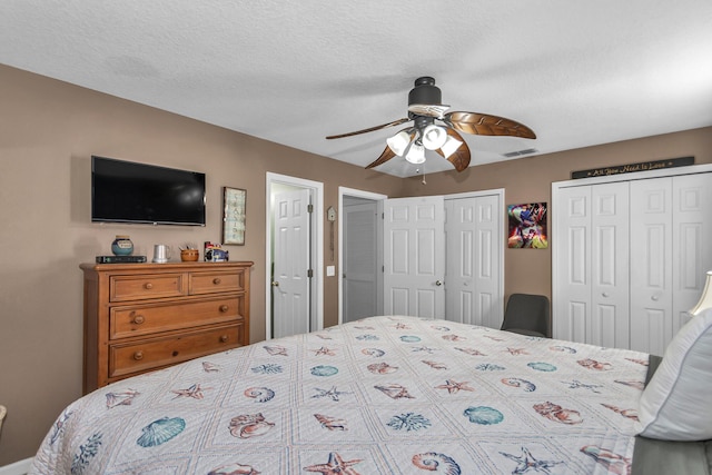 2650 Revolution St Unit 104, Melbourne, FL 32935 - bedroom featuring multiple closets and a ceiling fan