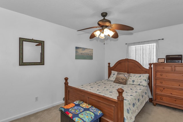 2650 Revolution St Unit 104, Melbourne, FL 32935 - bedroom with light carpet, baseboards, and ceiling fan