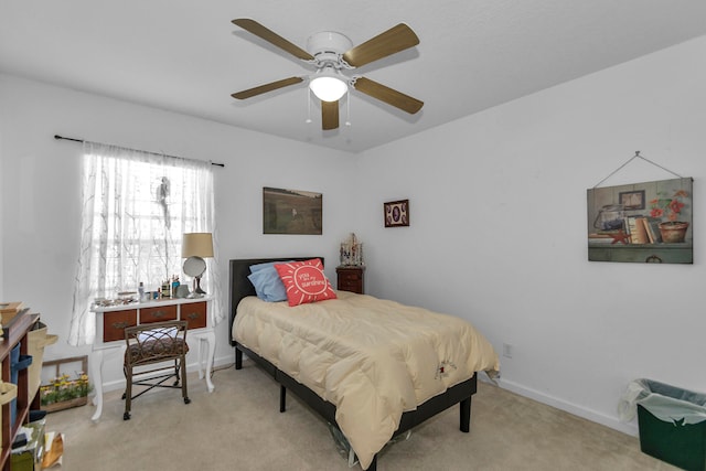 bedroom with light colored carpet and ceiling fan