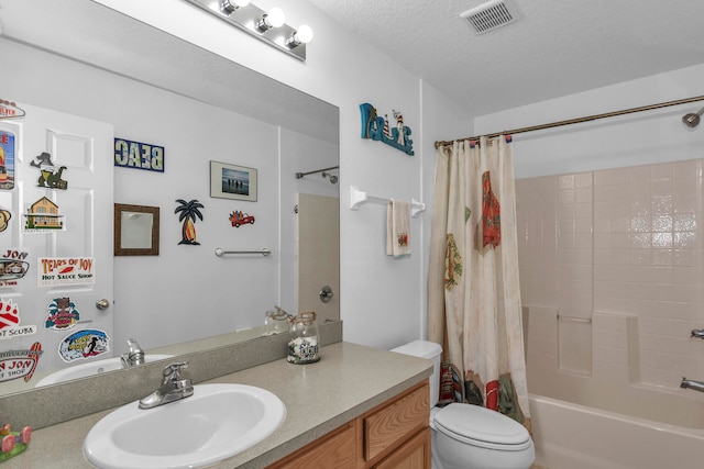 full bathroom with toilet, shower / tub combo, vanity, and a textured ceiling