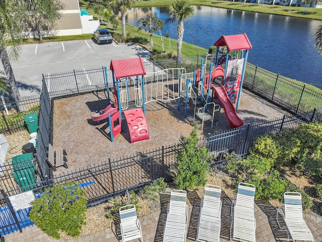 view of playground with a water view