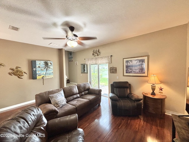 2650 Revolution St Unit 104, Melbourne, FL 32935 - living area with ceiling fan, wood finished floors, a textured ceiling, and baseboards