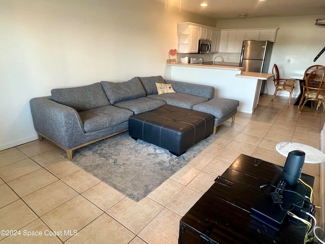 tiled living room featuring sink