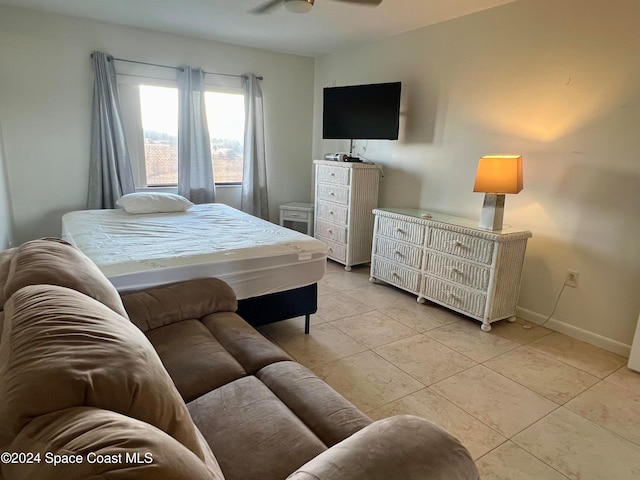 bedroom with light tile patterned floors and ceiling fan