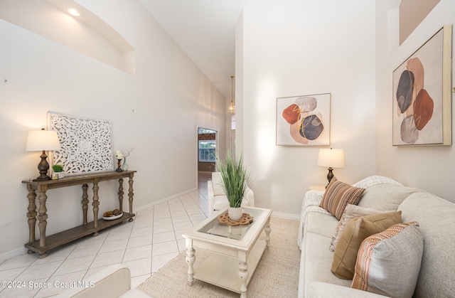 tiled living room with high vaulted ceiling