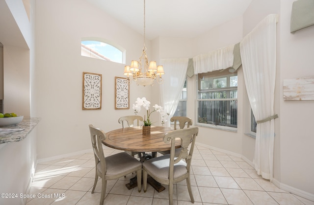 tiled dining area featuring an inviting chandelier