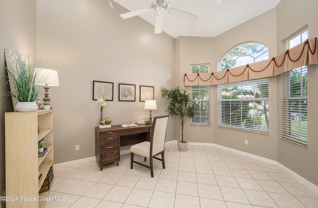 tiled office space with high vaulted ceiling and ceiling fan