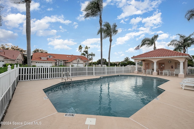 view of swimming pool with a patio