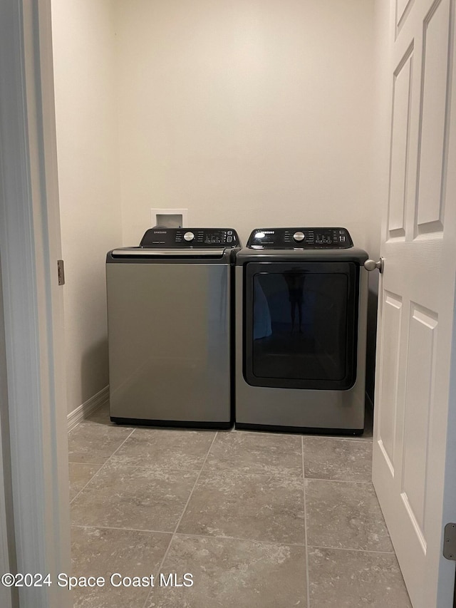 washroom with separate washer and dryer