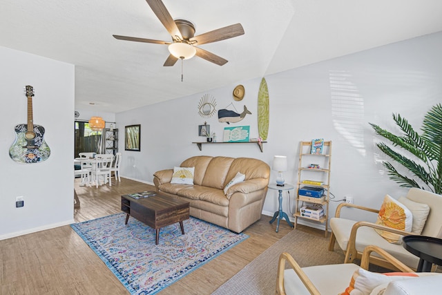 living room featuring ceiling fan and light wood-type flooring