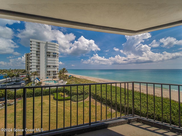 balcony with a view of the beach and a water view