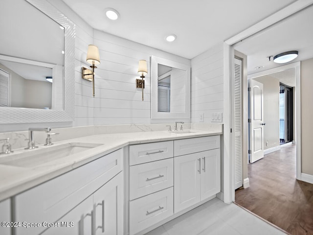 bathroom with hardwood / wood-style floors and vanity