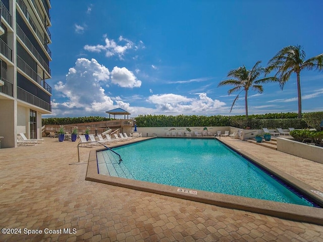 view of swimming pool featuring a patio area