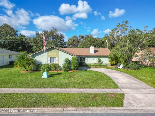 ranch-style home featuring a front lawn