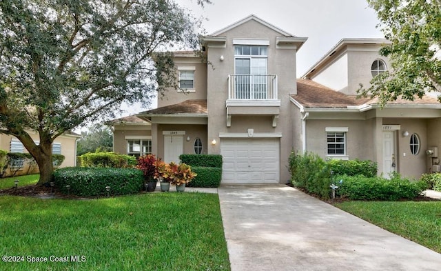 view of front of home featuring a garage and a front yard