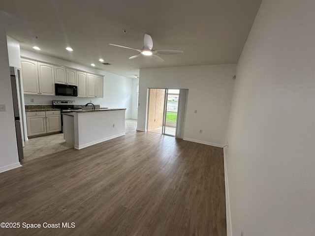 kitchen featuring white cabinetry, light hardwood / wood-style flooring, and ceiling fan