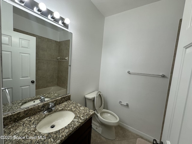 full bathroom featuring tile patterned floors, vanity, toilet, and tiled shower / bath