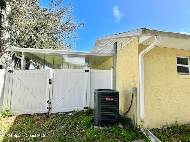 view of side of property with central AC