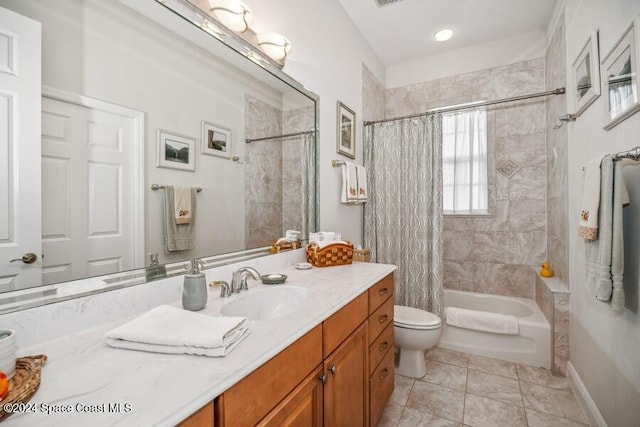 full bathroom featuring tile patterned floors, vanity, toilet, and shower / bathtub combination with curtain