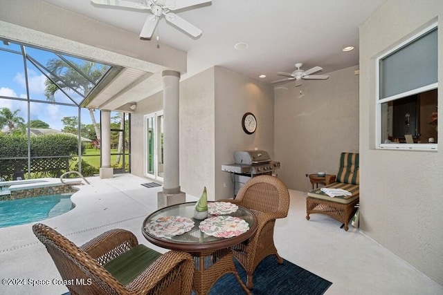 interior space featuring a lanai, grilling area, ceiling fan, and a swimming pool with hot tub