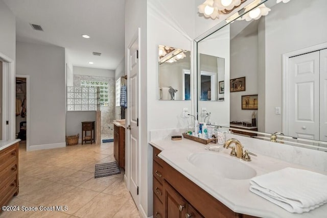 bathroom with vanity, tile patterned floors, and walk in shower