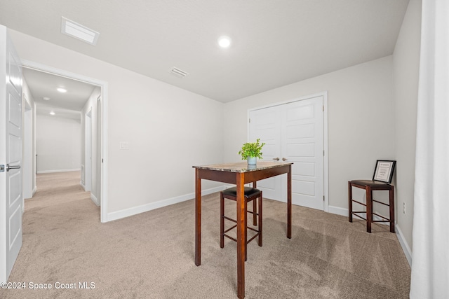 dining area with light carpet