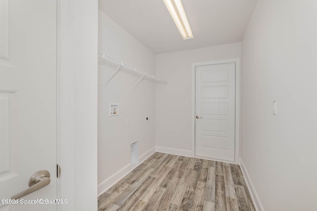 washroom featuring hookup for an electric dryer, light wood-type flooring, and washer hookup