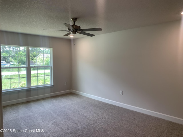 139 Whirl St SW, Palm Bay, FL 32908 - carpeted spare room featuring baseboards, a ceiling fan, and a textured ceiling