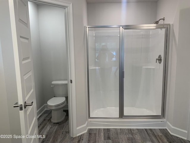 139 Whirl St SW, Palm Bay, FL 32908 - bathroom featuring a shower stall, baseboards, and wood finished floors