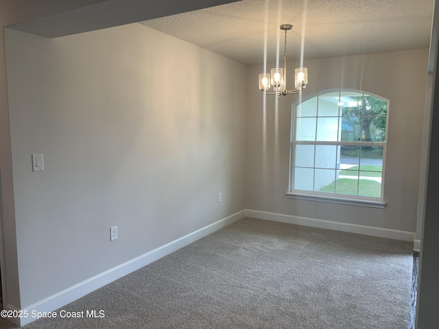 139 Whirl St SW, Palm Bay, FL 32908 - empty room with a chandelier, carpet, a textured ceiling, and baseboards