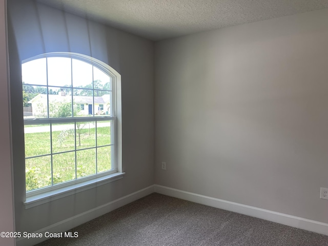 139 Whirl St SW, Palm Bay, FL 32908 - carpeted spare room with a textured ceiling and baseboards