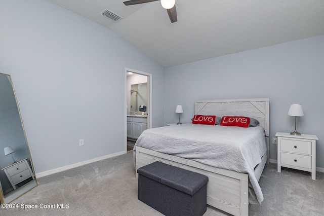 carpeted bedroom featuring connected bathroom, ceiling fan, and lofted ceiling