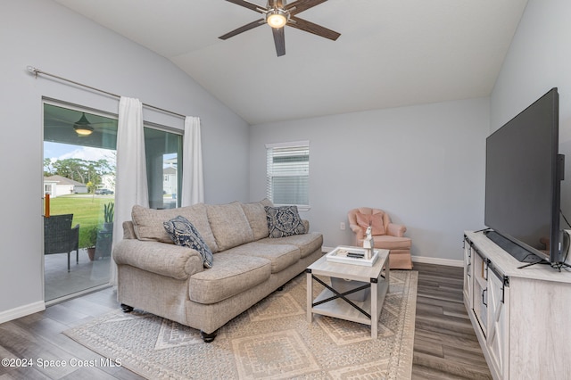 living room featuring lofted ceiling, ceiling fan, and wood-type flooring