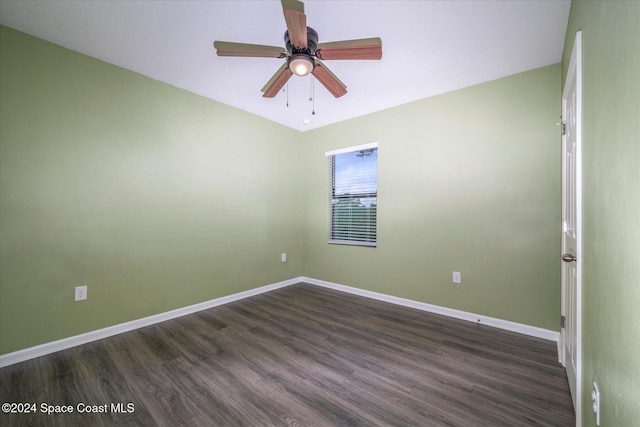 empty room featuring ceiling fan and dark hardwood / wood-style floors