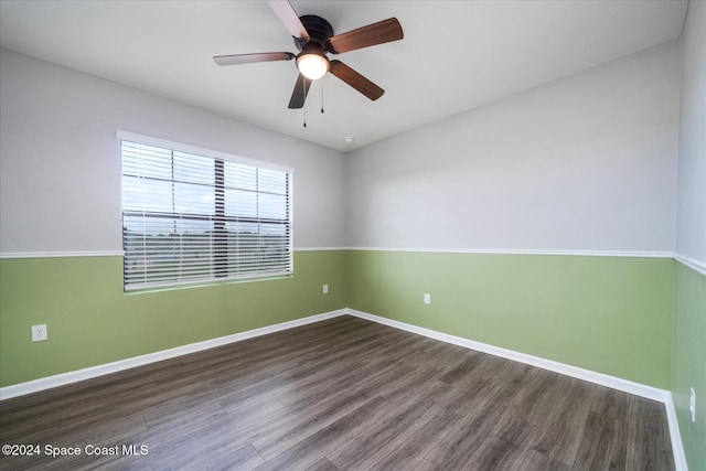 spare room with hardwood / wood-style flooring and ceiling fan