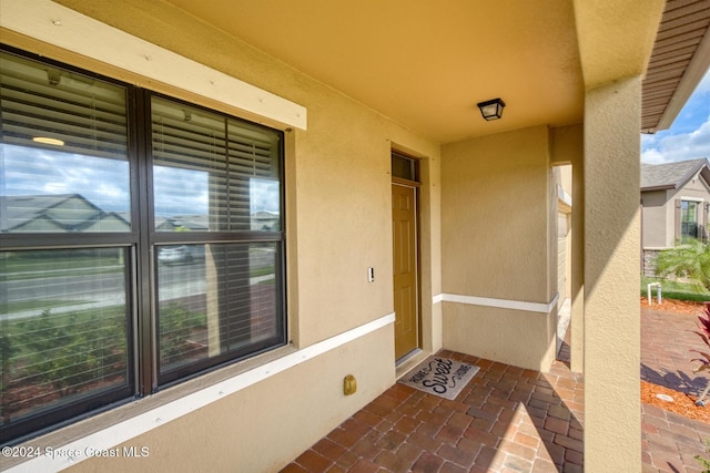 property entrance with a patio area