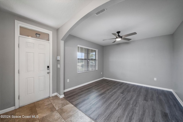 foyer entrance featuring dark hardwood / wood-style floors and ceiling fan