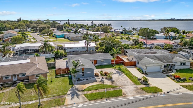 birds eye view of property featuring a water view