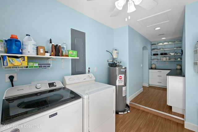 washroom with electric water heater, electric panel, ceiling fan, independent washer and dryer, and light hardwood / wood-style floors