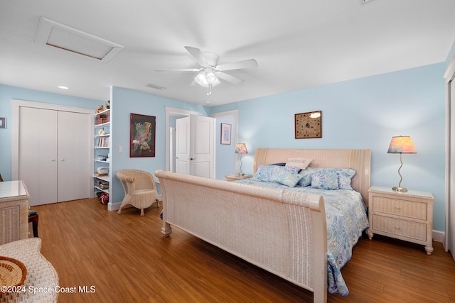 bedroom featuring a closet, hardwood / wood-style flooring, and ceiling fan