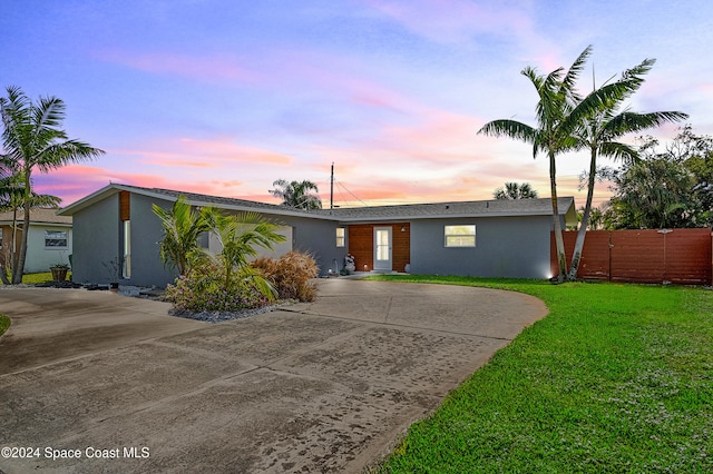 view of front of home with a yard