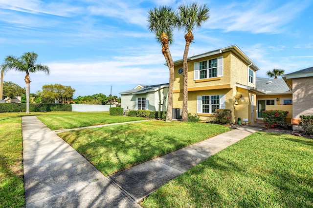 view of front of property featuring central AC and a front lawn