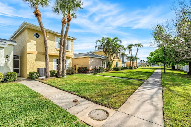 view of property's community featuring a yard