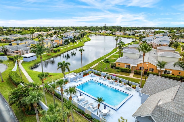 view of swimming pool with a water view