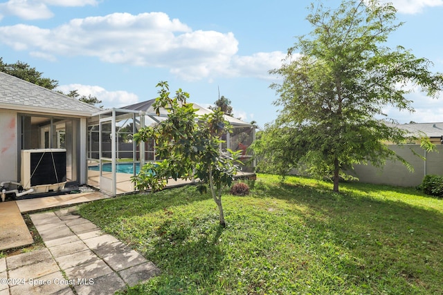 view of yard with a lanai