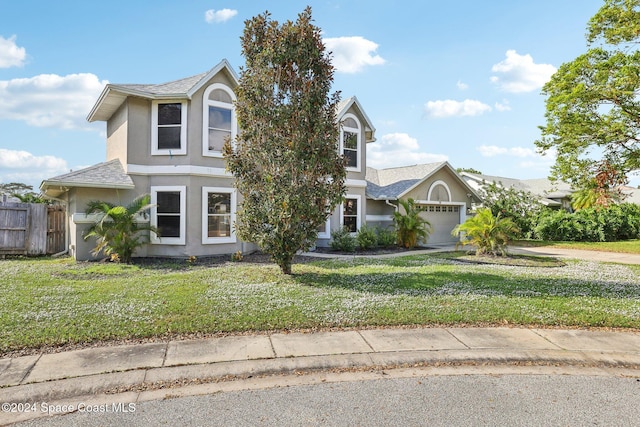 view of front of house featuring a garage and a front yard