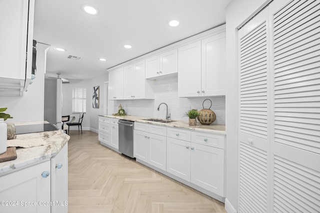 kitchen with white cabinetry, sink, and appliances with stainless steel finishes